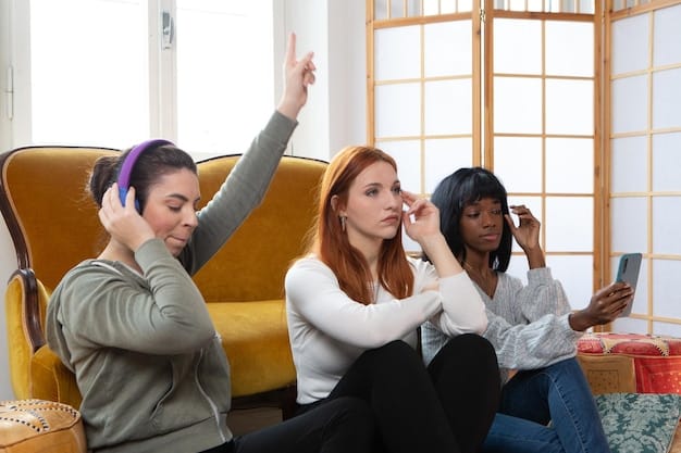 A group of friends sitting together, some with their hands over their ears and eyes closed, while another friend gestures dramatically with a smartphone in hand, seemingly about to reveal a spoiler.